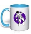 Mug with a colored handle An astronaut in round space sky-blue фото