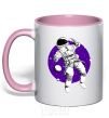 Mug with a colored handle An astronaut in round space light-pink фото