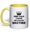 Mug with a colored handle Keep calm i have the coolest brother yellow фото