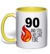 Mug with a colored handle 90 and still hot like fire yellow фото