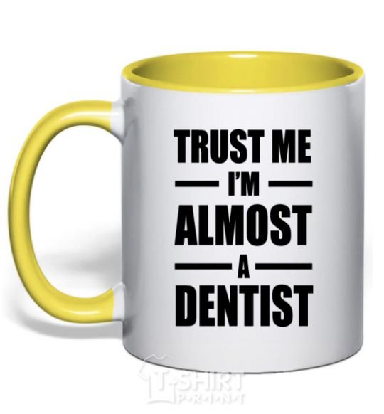 Mug with a colored handle Trust me i'm almost dentist yellow фото