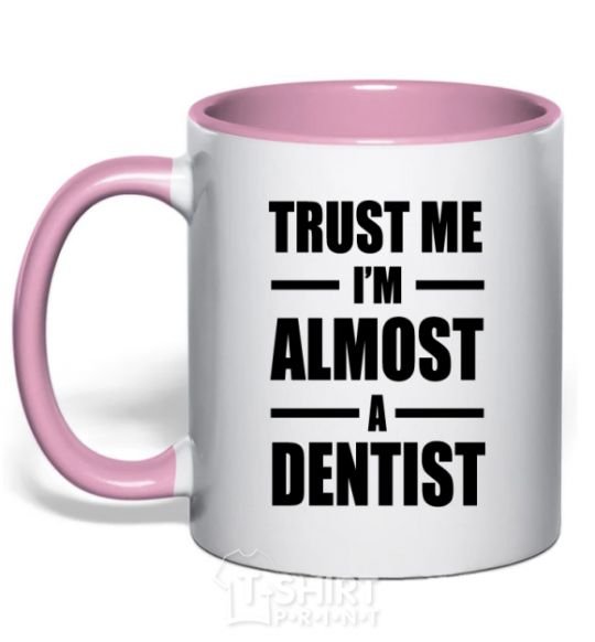 Mug with a colored handle Trust me i'm almost dentist light-pink фото