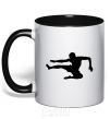 Mug with a colored handle A fighter in a jump black фото