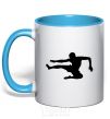 Mug with a colored handle A fighter in a jump sky-blue фото