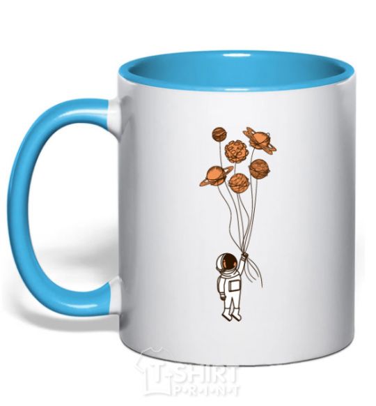 Mug with a colored handle An astronaut with balls of planets sky-blue фото