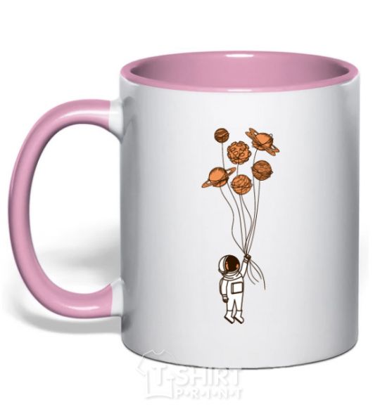 Mug with a colored handle An astronaut with balls of planets light-pink фото