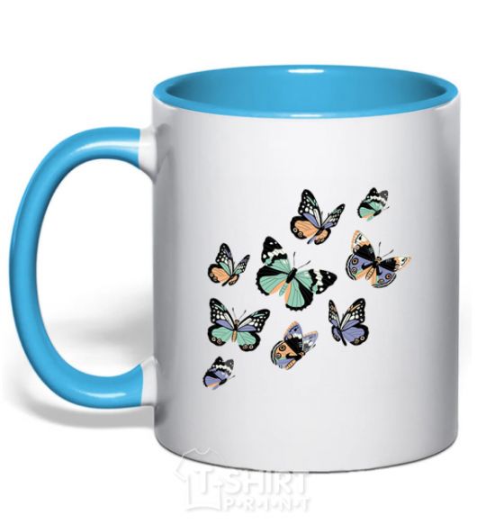 Mug with a colored handle A drawing of butterflies sky-blue фото