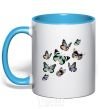 Mug with a colored handle A drawing of butterflies sky-blue фото