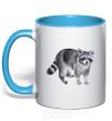 Mug with a colored handle A drawing of a raccoon sky-blue фото