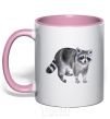 Mug with a colored handle A drawing of a raccoon light-pink фото