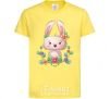 Kids T-shirt Cute bunny with flowers cornsilk фото